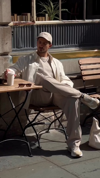 casual shirt, trousers, baseball cap, sneakers, crew neck sweater, menswear outfit, brand awareness, lifestyle, outdoor, calm, trustworthy, neutral, brown